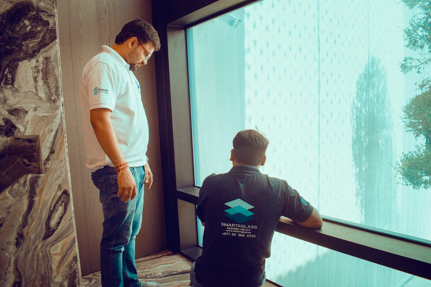 SEG technicians installing smart glass