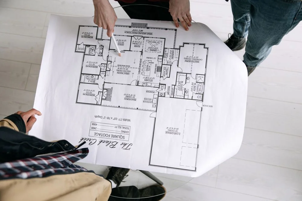 Architects reviewing architectural floor plans